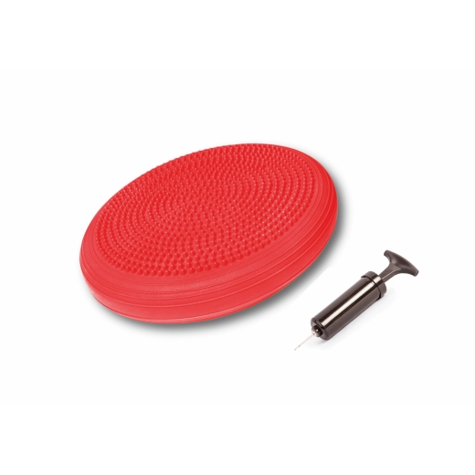 Czerwony dysk sensoryczny i leżąca obok pompka